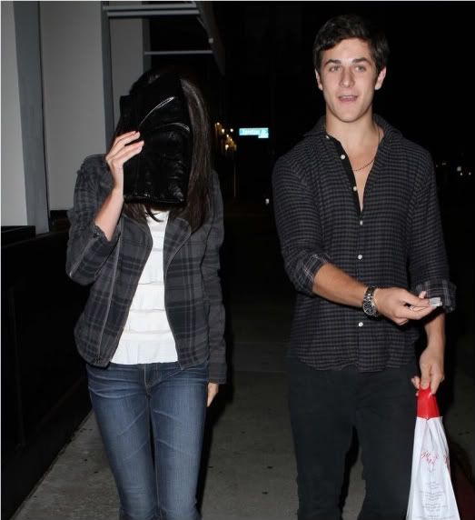 Selena and David Date Night Selena Gomez shields her face while photogs 