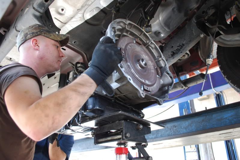 Step 12: Slide off your stock torque converter. Watch out though, its pretty heavy for its size, and its going to leak fluid everywhere.