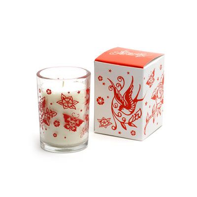  cherry red tattoo designs swirl around a good sized white candle (which 