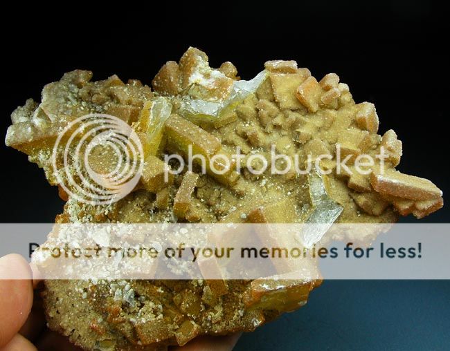 Bright yellow coated quartz cluster  