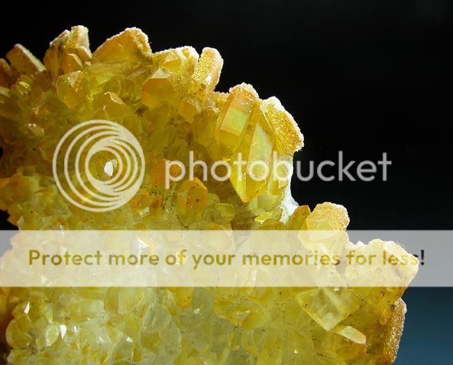 Bright yellow coated quartz cluster  